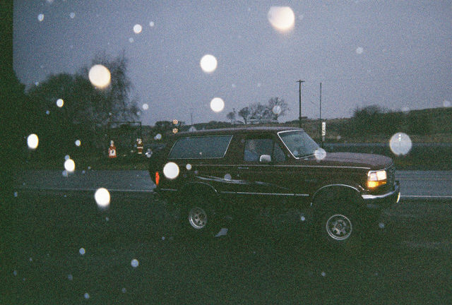 Red 1992 Ford Bronco 3q-front view with side decal