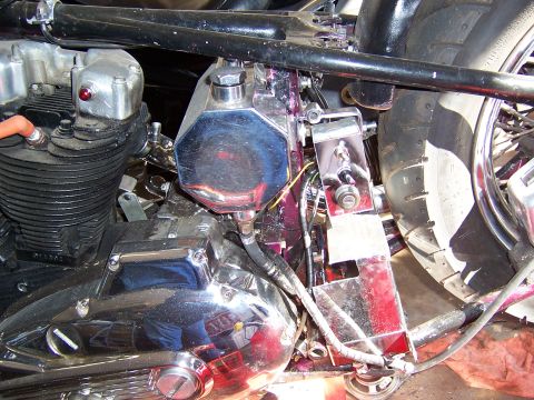 1979 Ford Ranchero - This image shows the engine and various components of a motorcycle, including a chrome oil tank and part of the rear wheel.