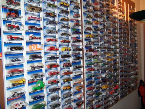 1979 Ford Ranchero - Extensive collection of Hot Wheels toy cars displayed on a wall.
