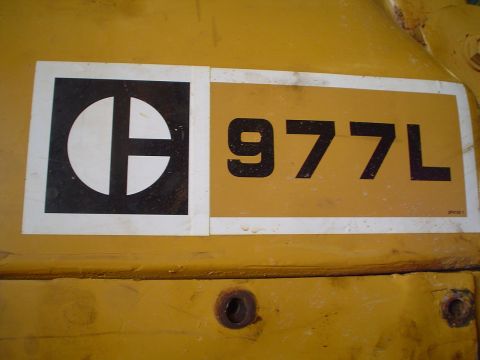 1966 International School Bus - Close-up of the Caterpillar logo and model number on a piece of heavy machinery.