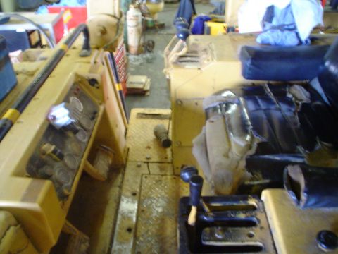 1966 International School Bus - Interior view of a yellow vehicle's dashboard and seats, with gauges and controls visible.