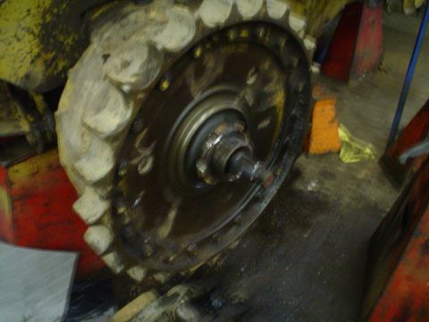 1966 International School Bus - Close-up of a heavy-duty track wheel assembly, likely from construction equipment.