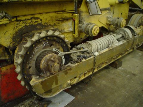 1966 International School Bus - Detail of a track assembly, showing the sprocket and suspension system. Part number OA08512 is marked on the sprocket.