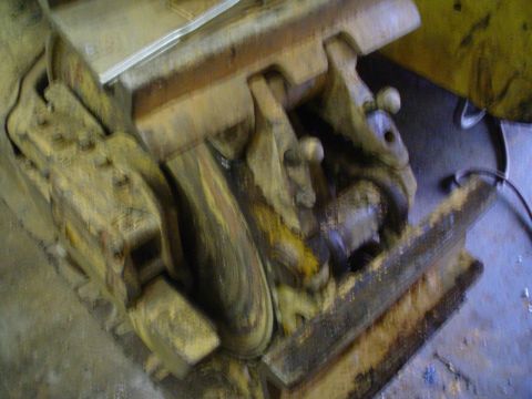 1966 International School Bus - This is a close-up of a heavily rusted mechanical component, likely a part of heavy machinery.