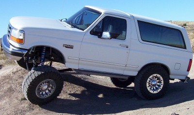 1995 Ford Bronco - This lifted 1995 Ford Bronco is shown off-road with its suspension clearly visible.