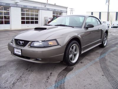 1998 Ford Taurus - This 2001 Ford Mustang GT is a two-door coupe with a distinctive hood scoop.