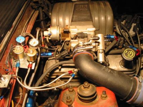 1981 Ford Mustang - Custom engine bay setup with auxiliary gauges and plumbing. The oil cap indicates 'Engine'.