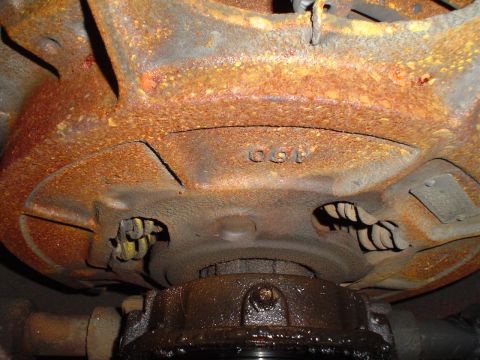 1966 International School Bus - Undercarriage part shows visible stamped numbers, but no clear vehicle identification.