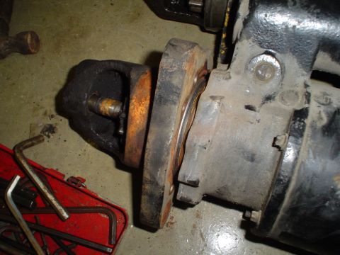 1966 International School Bus - Close-up of a vehicle drivetrain component with tools nearby.