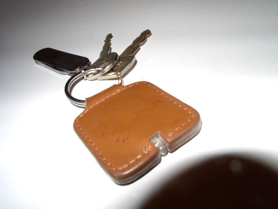On the same chain is the tiny little one inch blade that's gonna cut through the seat belt, as I'm upside down in the ditch, with the water rising.