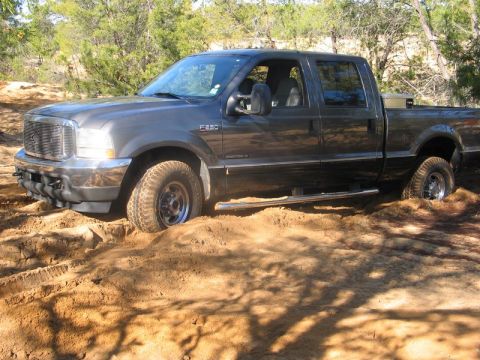 1995 Ford Bronco - Ford F-250 Super Duty stuck in sand off-road.