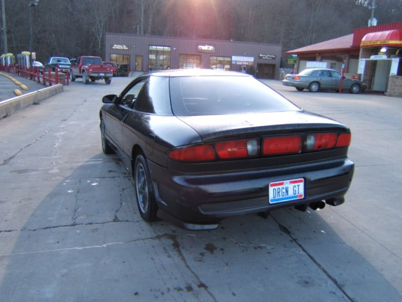 Dark Ford Probe GT coupe rear three-quarter with DRGN GT plate