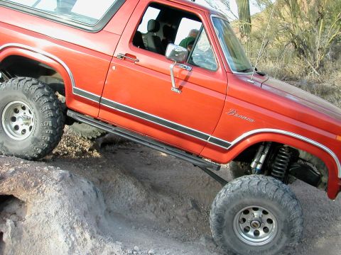 1984 Ford Bronco - This 1984 Ford Bronco is shown navigating a challenging off-road course.