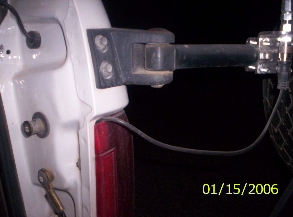 Here's a picture showing how I routed my antenna. I just took off the tail light lense and popped it on through.