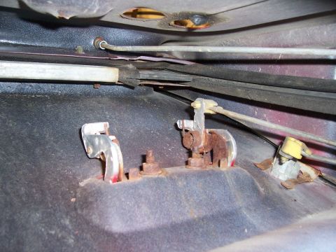 1978 Ford Bronco - Close-up view of the internal door latch and linkage system, showing wear and rust.