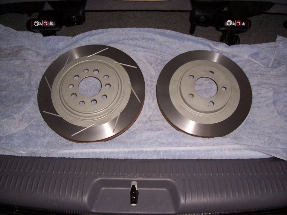 Two slotted brake rotors on a towel