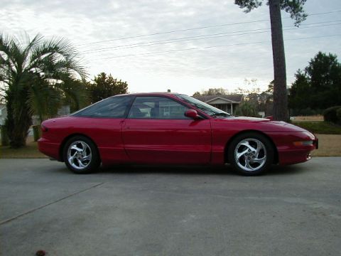 1997 Ford Probe - Red 1997 Ford Probe coupe parked on a concrete driveway.