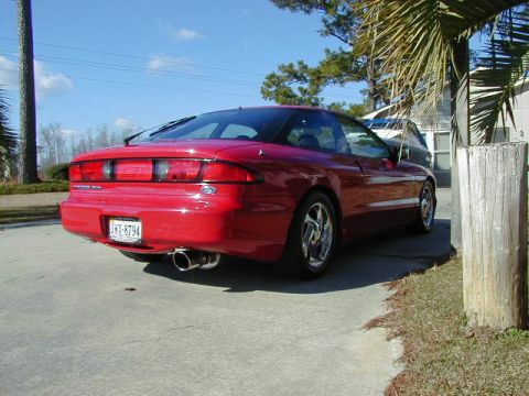 1997 Ford Probe - This 1997 Ford Probe is shown from the rear, a custom exhaust system and aftermarket wheels.