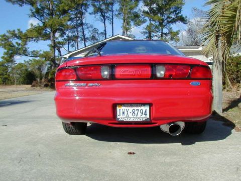 1997 Ford Probe - Rear view of a red 1997 Ford Probe with a custom exhaust tip.