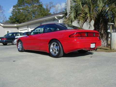 1997 Ford Probe - The rear view of a red 1997 Ford Probe shows its taillights and license plate.