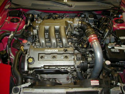 1997 Ford Probe - Engine bay view of a Mazda V6 DOHC 24-valve engine.