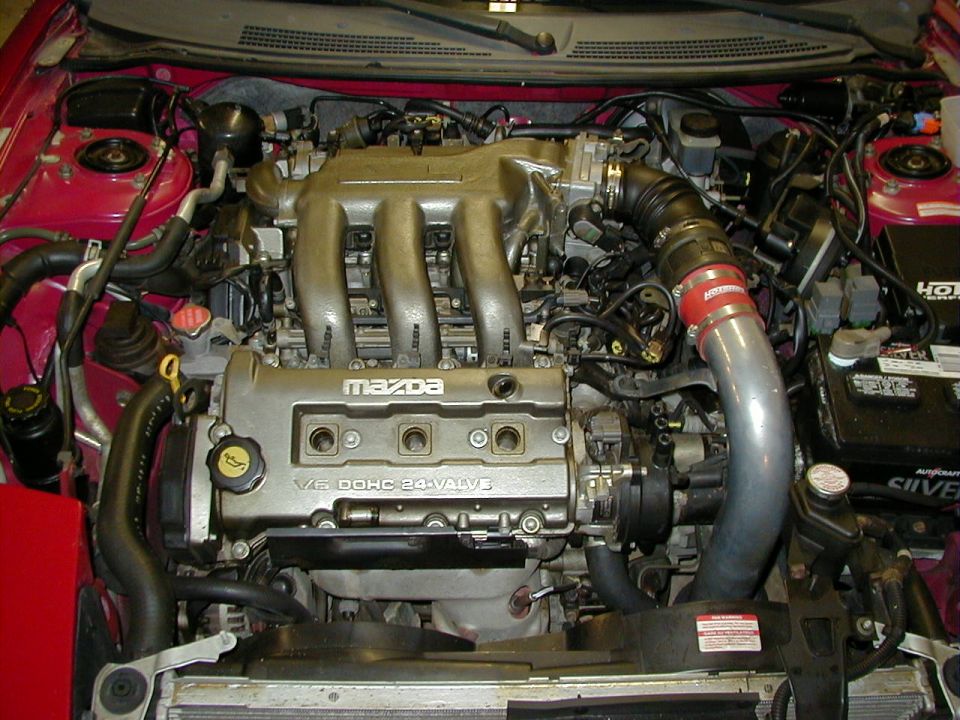 Mazda V6 DOHC 24-valve engine with silver intake manifold and red "HPS" hose clamp
