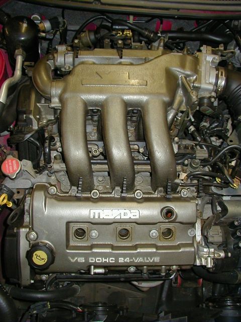 1997 Ford Probe - Engine bay view of a Mazda V6 DOHC 24-valve engine.