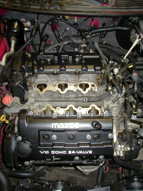 1997 Ford Probe - Close-up of a Mazda V6 engine, showing the cylinder heads and intake ports.