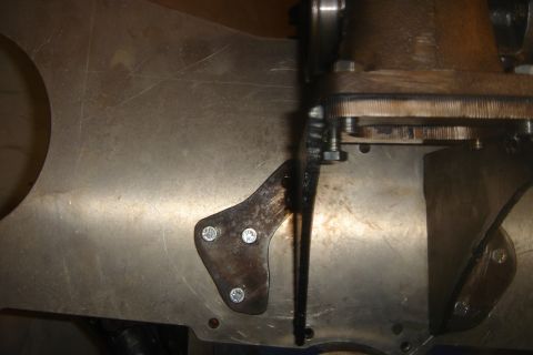 1969 Ford Mustang - Close-up view of a turbocharger exhaust housing and its associated mounting hardware.