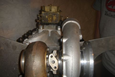 1969 Ford Mustang - Close-up of a turbocharger and carburetor setup, likely for an engine build.