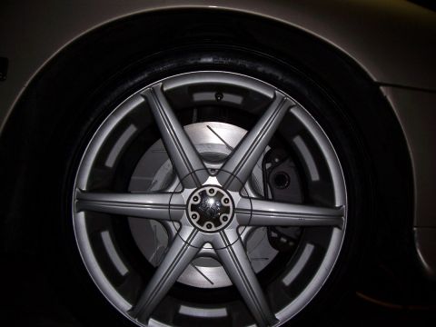 1998 Mercury Sable - Close-up of a vehicle's wheel and brake system, with a watermark for Supermotors.net visible.