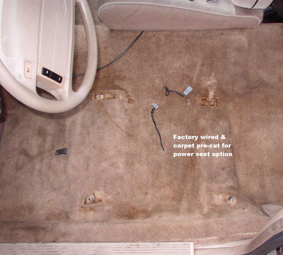 I was planning on adding the wiring for the power seat, but I found it tucked into the harness under the threshhold.  The carpet was already cut.  I should have steamed some of the previous owner's coffee out of the carpet, but I didn't have time, and it's windy at about 35°.
