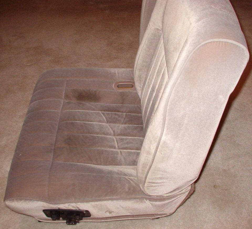 The difference is visible here: the original recline lever hole is there but not obvious, and I cut the switch hole a little too large.  The seat covers are MUCH cleaner after having been thru the washing machine.