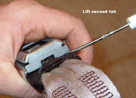 1994 Ford Crown Victoria - Since I also wanted to wash the seat belts, I disassembled the buckle. Note that the passenger buckle cover does NOT have the notch visible…