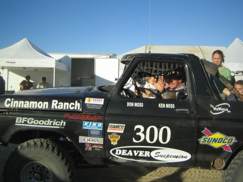 1990 Ford Bronco - Side of black race truck number 300 showing Cinnamon Ranch, BFGoodrich and driver names Don Moss and Ken Moss.