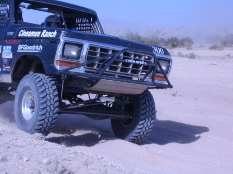 1990 Ford Bronco - close shot of a black race truck's front end shows the 300 number, brush guard and "Cinnamon Ranch" and BFGoodrich decals.