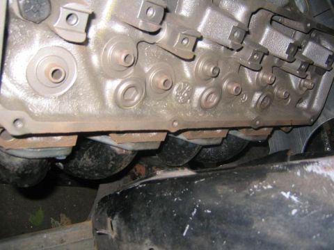 1969 Ford Mustang - Engine block detail with exhaust ports visible.