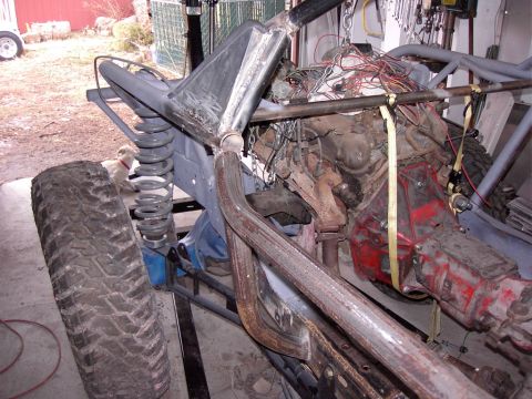 1981 Ford F-150 - This custom buggy build features a prominent engine, heavy-duty suspension, and a large off-road tire, indicating a focus on performance an…