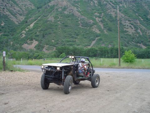 1981 Ford F-150 - Custom off-road buggy with roll cage and off-road tires parked on a dirt road with a mountain in the background.