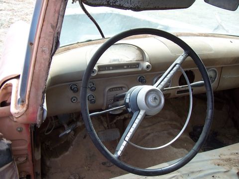 1955 Ford Customline - Interior view of a 1955 Ford Customline, the dashboard and steering wheel.
