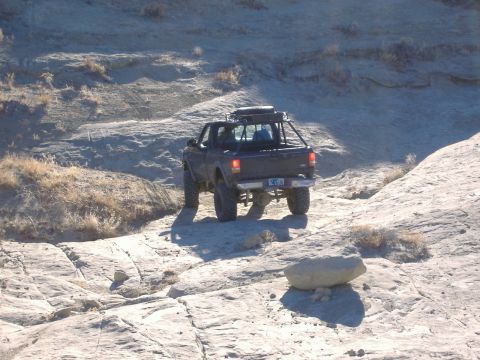 1978 Ford Bronco - Pickup truck navigates a challenging rocky off-road course.