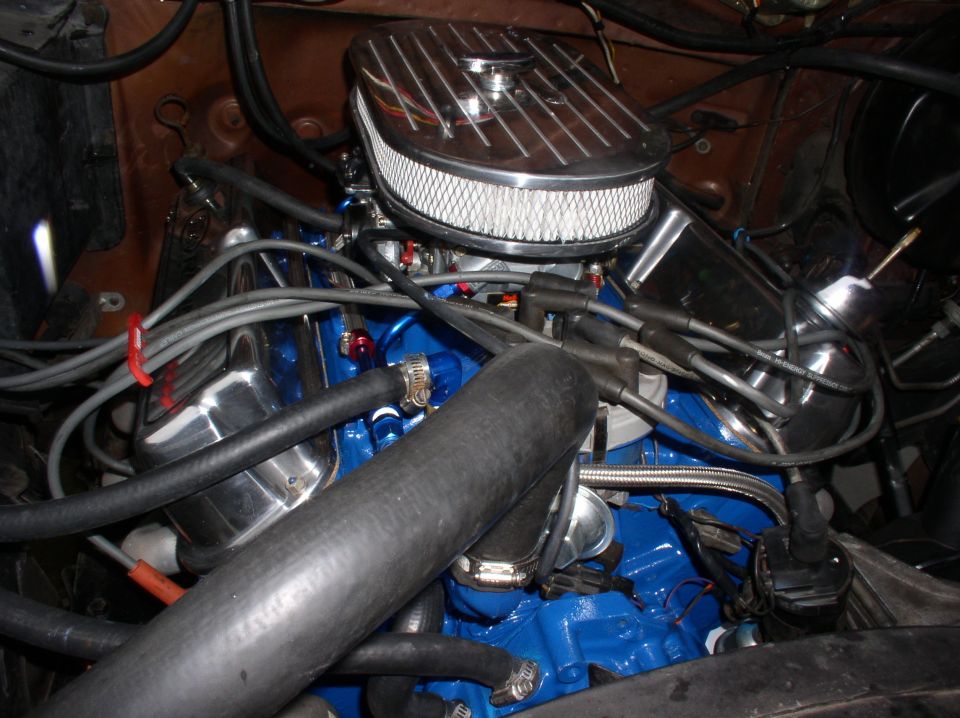 Blue engine with chrome air cleaner and braided fuel lines