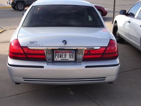 2000 Ford Crown Victoria - Rear view of a silver 2000 Ford Crown Victoria Grand Marquis LS, showing its taillights and license plate.