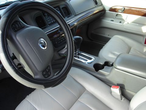 2000 Ford Crown Victoria - Interior view of a 2000 Ford Crown Victoria, highlighting the dashboard and seating.