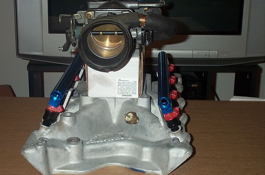 Aftermarket throttle body and intake manifold with fuel rails