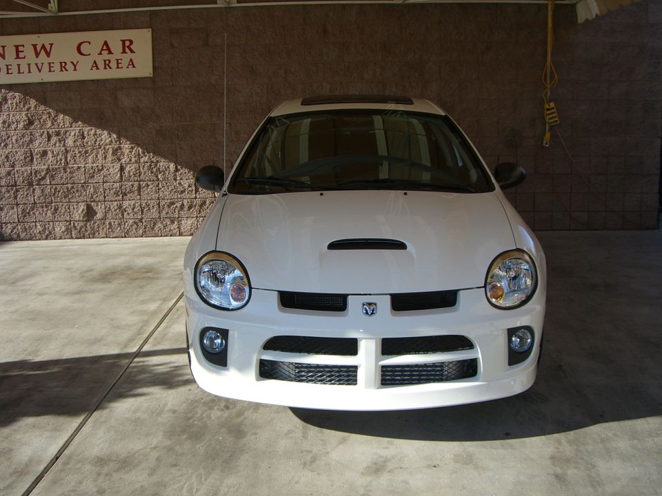 White Dodge Neon SRT-4 front view with hood scoop