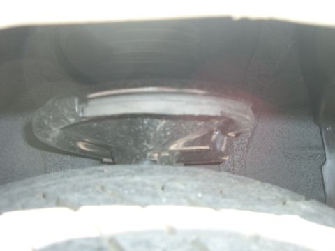 1996 Ford Probe - This image shows a close-up view of a vehicle's suspension system, focusing on the spring and its mounting point.