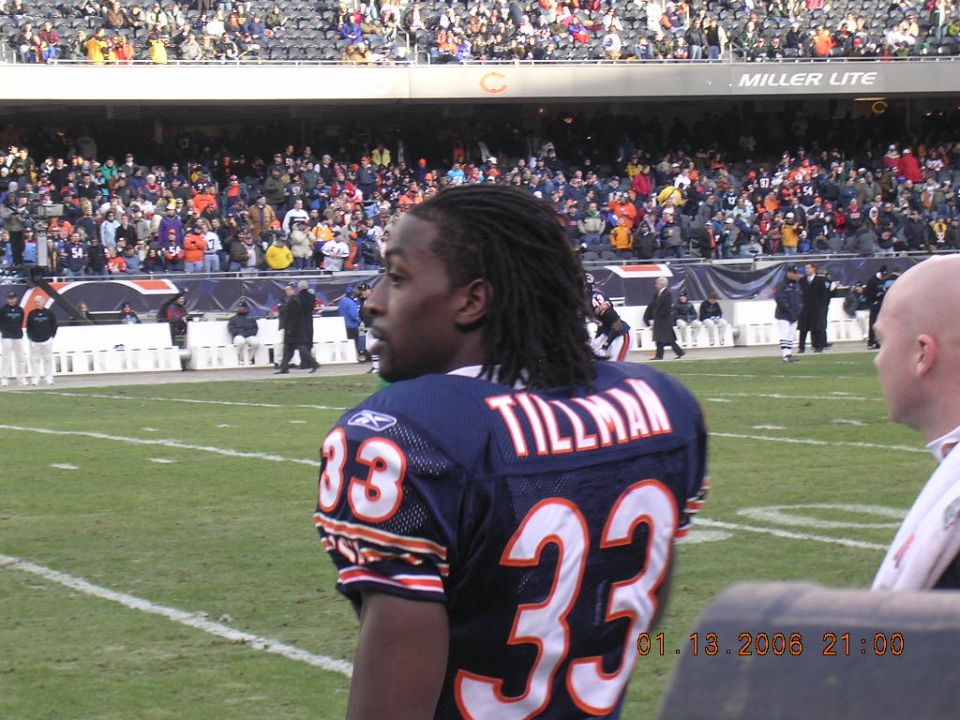 Football player wearing a navy blue jersey with the name TILLMAN and number 33 on the back, standing on a field