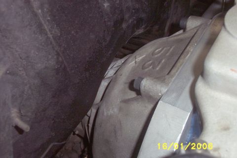 1967 Ford Galaxie - A close-up view of an engine component, showing embossed numbers and a date stamp.