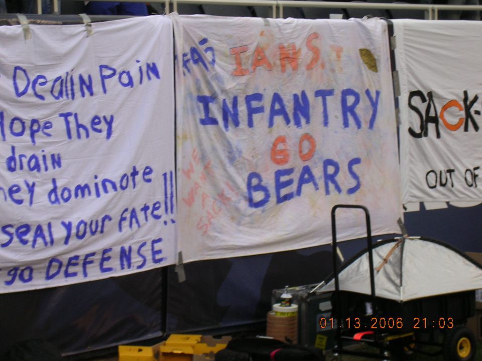 Banners with sports slogans like 'Dealin Pain', 'Infantry Go Bears', and 'Sack-Out'